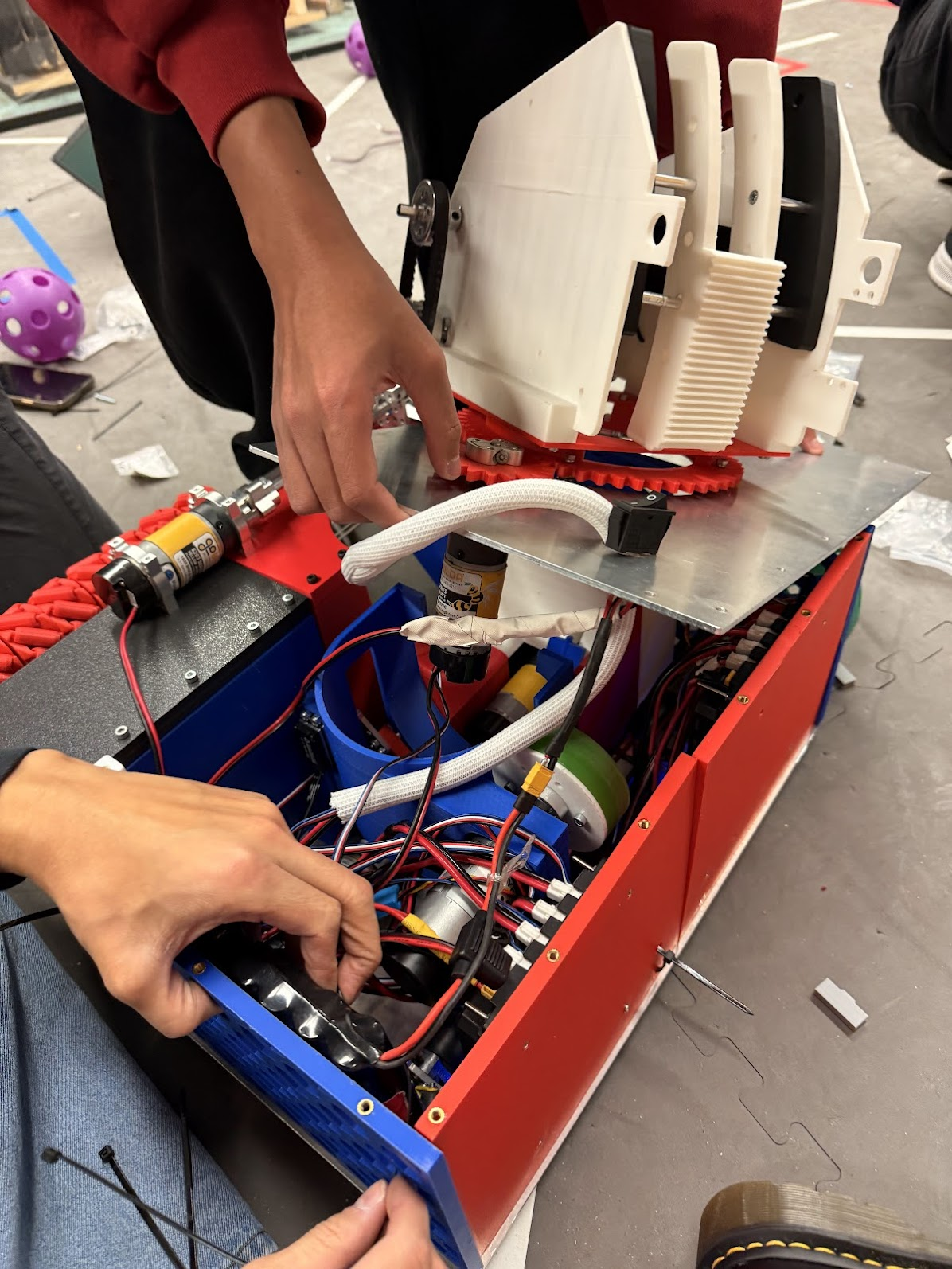 Close-up of the FTC robot turret, shooter housing, gear ring, camera, and wiring