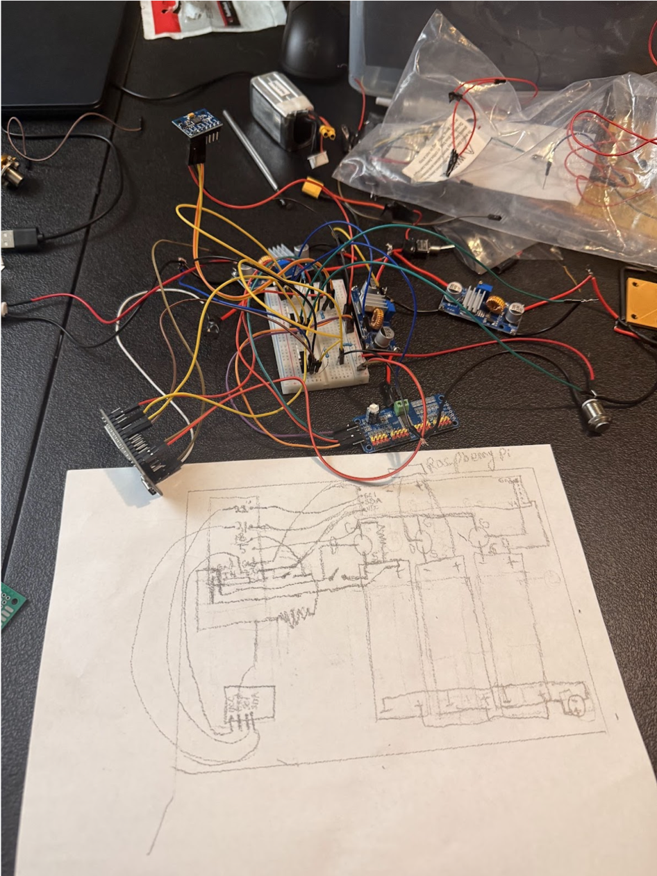 Breadboard prototype and hand-drawn robot dog circuit sketch